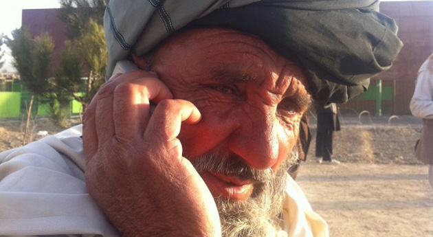 Afghan man on mobile phone